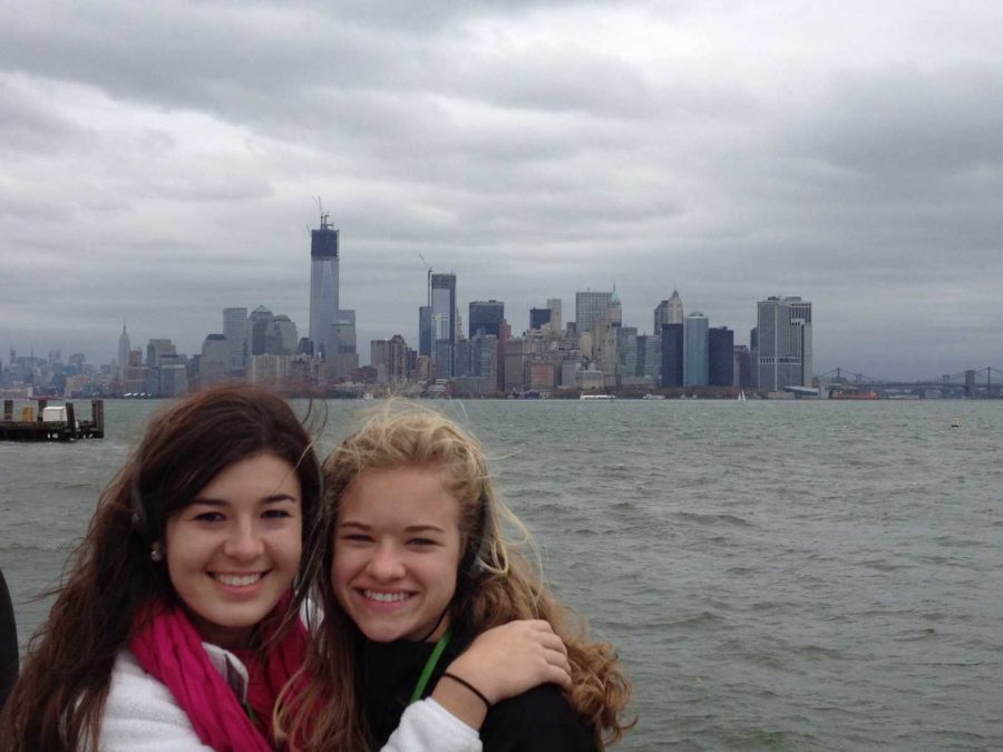 Rachel Stuart and Katherine Doan in front of the New York City skyline.