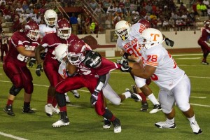 Texas High defenders take down the opposing running back during Friday's rivalry game.