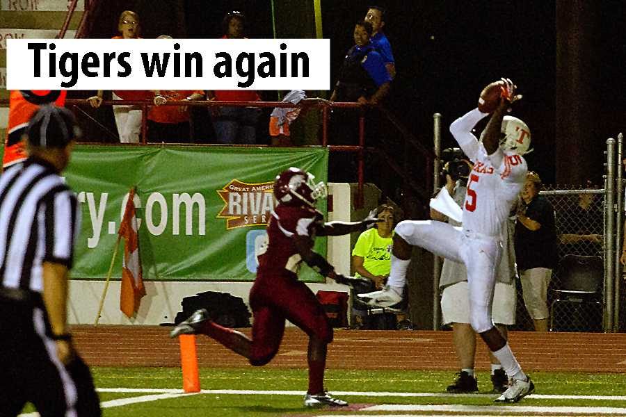 Senior Taylor Jackson makes an acrobatic catch in the end zone to help the Tigers secure a 16-0 win over Arkansas High Friday.