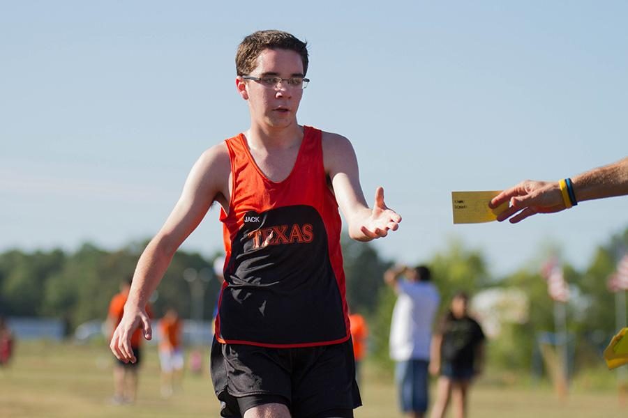 Freshman cross country runner Jonathan Rowland completes one of his first high school meets.