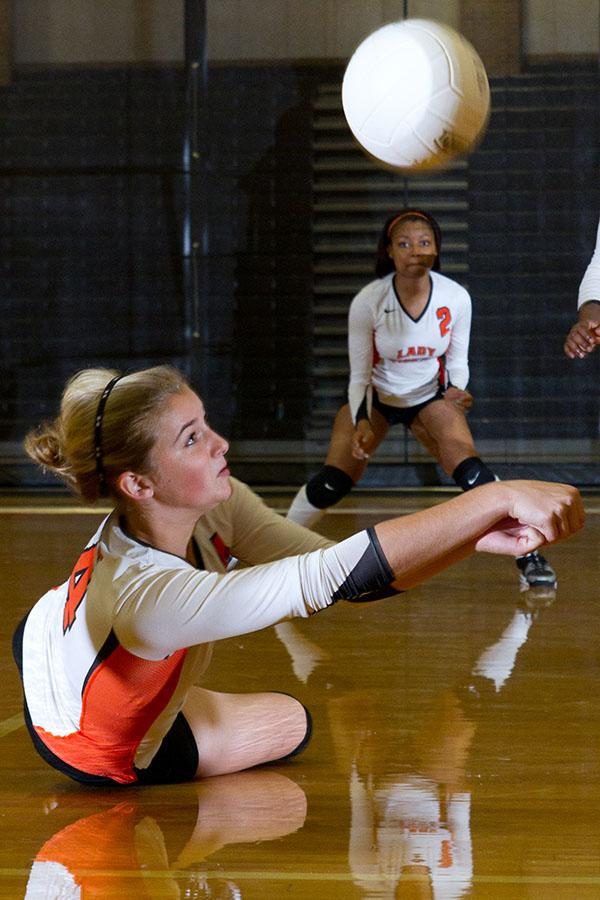 Sophomore Chealsea Slider digs up the ball in a game against Chapel Hill. The varsity team defeated the Devils.