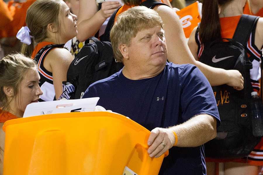 Roger Waldrep carries the spirit necessities for a Friday night football game. Waldrep was honored for his volunteer work Sept. 20 in Austin with a Heroes for Children Award.