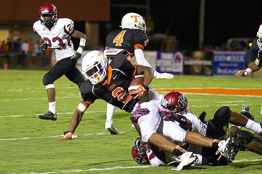 Senior running back Trey Walker is taken down by a Liberty Eylau defender.