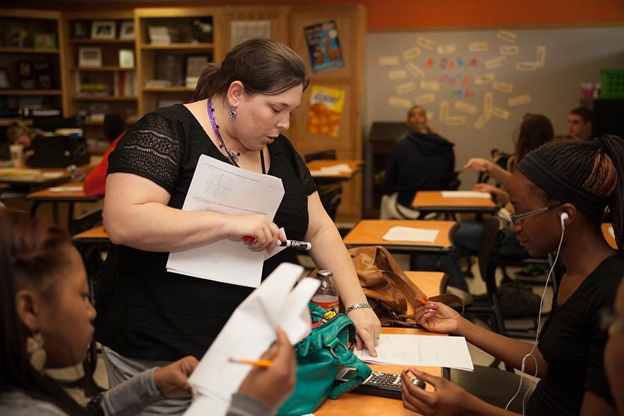 College algebra teacher Amanda Bickham helps student with the lesson for the day.