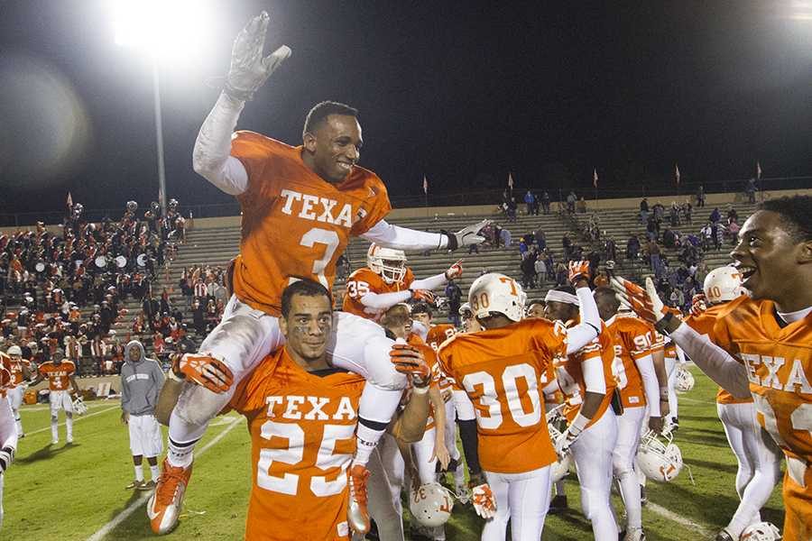 Senior Terrence Butler rides on the shoulders of senior Larry Murphy following the Tigers win against Hallsville, 21-9.