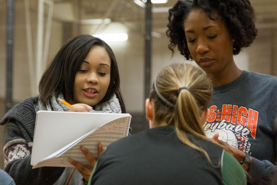 Manager of the basketball team, senior Chelse Williams, works on the score book for the team.