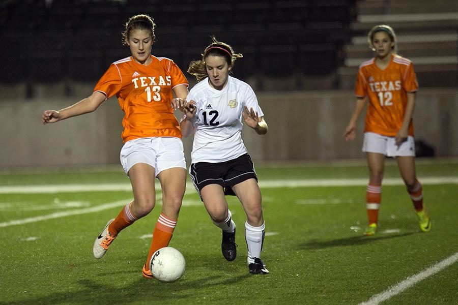 Junior Hannah Brantley tries to save the ball as a PG defender tries to take it during the game Tuesday. The girls lost 2-0.