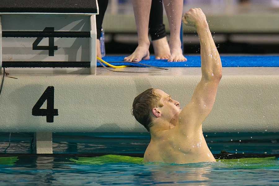 Senior Chris Radomski reacts to his first place finish in the 100 yard butterfly at the state meet in Austin.