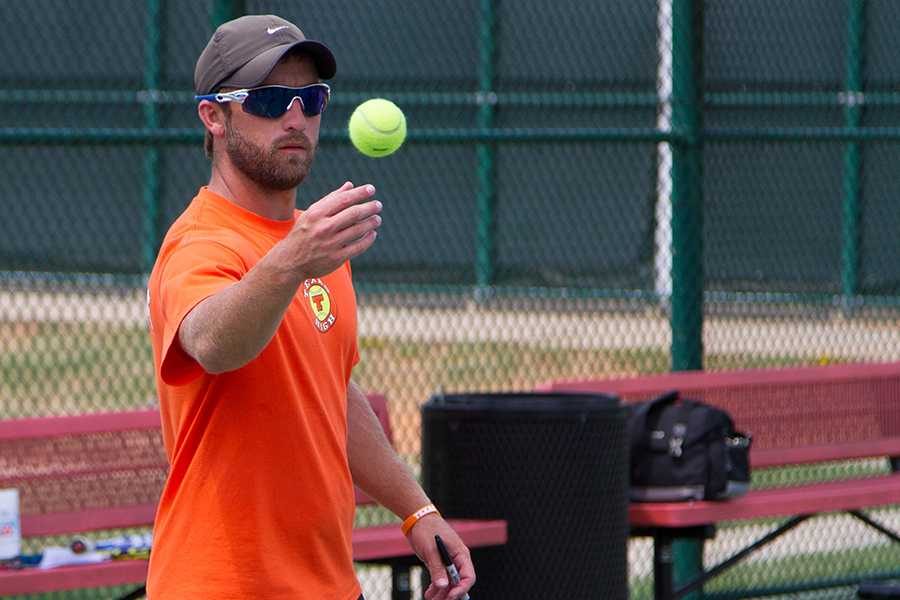 Coach James Sinard works with his players in afternoon practice. Sinard replaced longtime coach John Watson