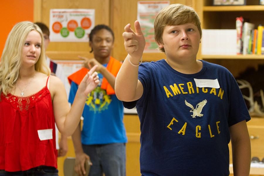 Freshman Avery Farren practices the school song during Tiger Camp Aug. 16