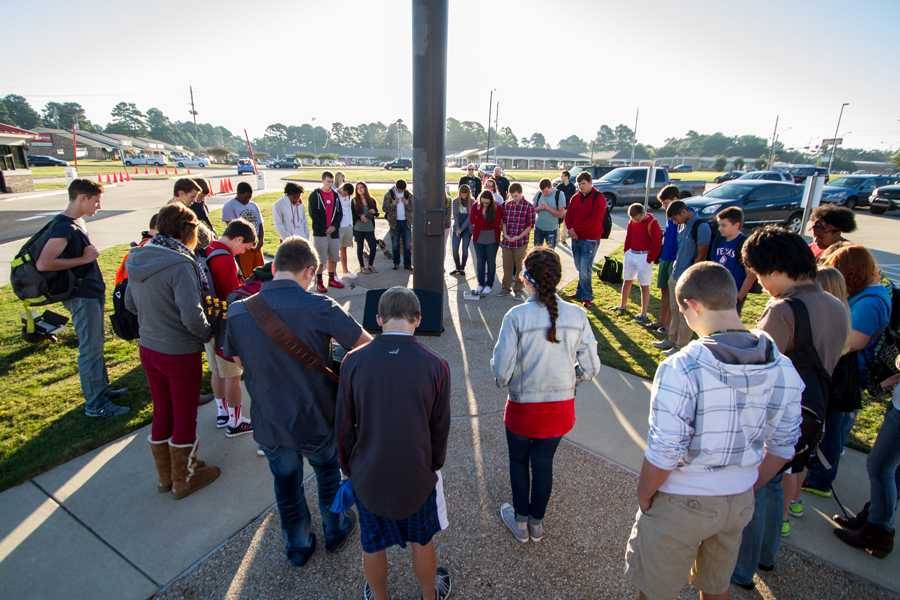 Students gather around the flagpole for the annual See You at the Pole event.