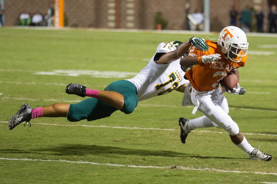 Texas Highs Jakardi Witcher is tackled from behind while trying to turn the corner on a sweep play. Texas High lost to Longview 20-38.