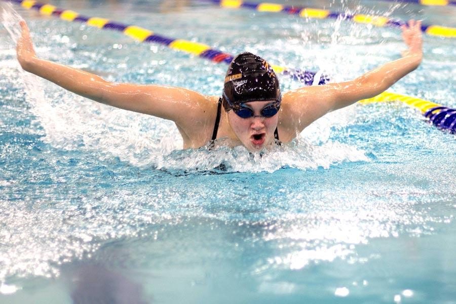 Sophomore Alex Jones competes in the fly at the Mansfield swim meet.