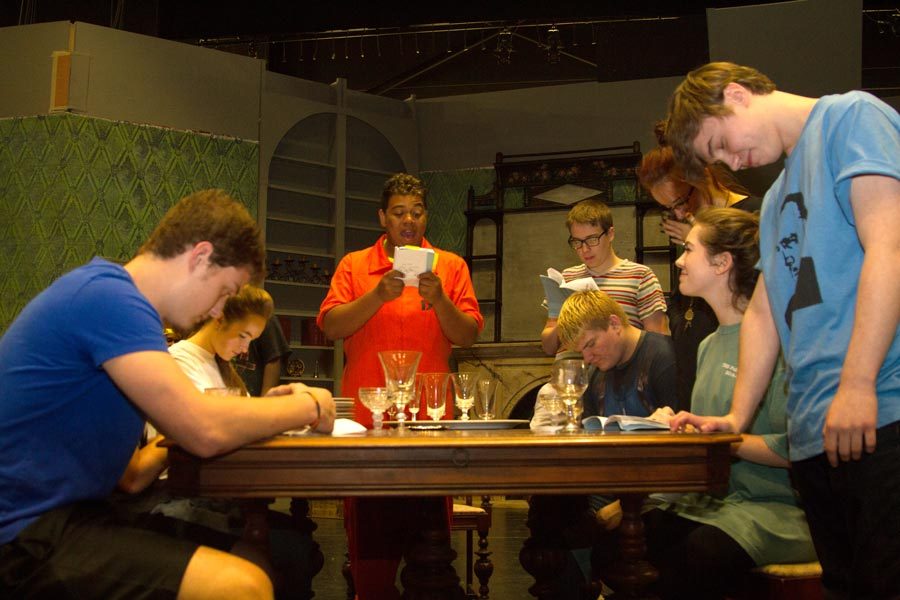 Cast members practice the dinner scene of the play You Cant Take It With You. Opening night for the show is Nov. 6.