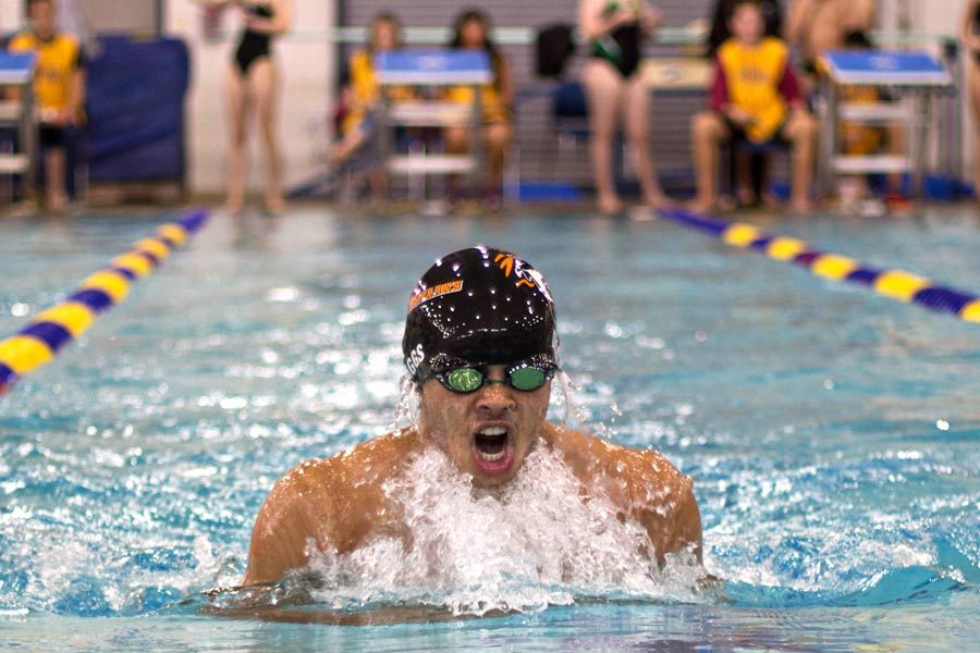 Junior Conor Diggs crashes through surface, chugging air, in Red River Shootout