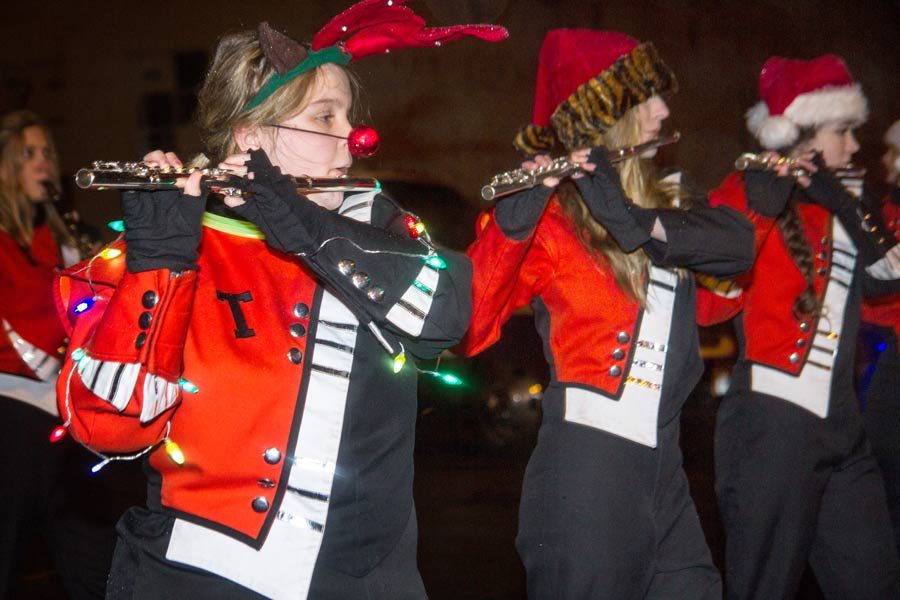 Band director Mr. Lawson told us to wear decorations while we marched in the parade, freshman flautist Shelby Reed said. I wore two strings of LED lights, a light-up reindeer nose and set of antlers. It made me feel the Christmas spirit.