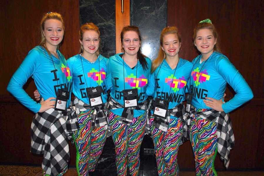 Olivia Blann, Rachel Qualls, Tristen Collins, Katherine Doan and Claire Doan smile for the camera before dancing in the Macys Thanksgiving Day Parade