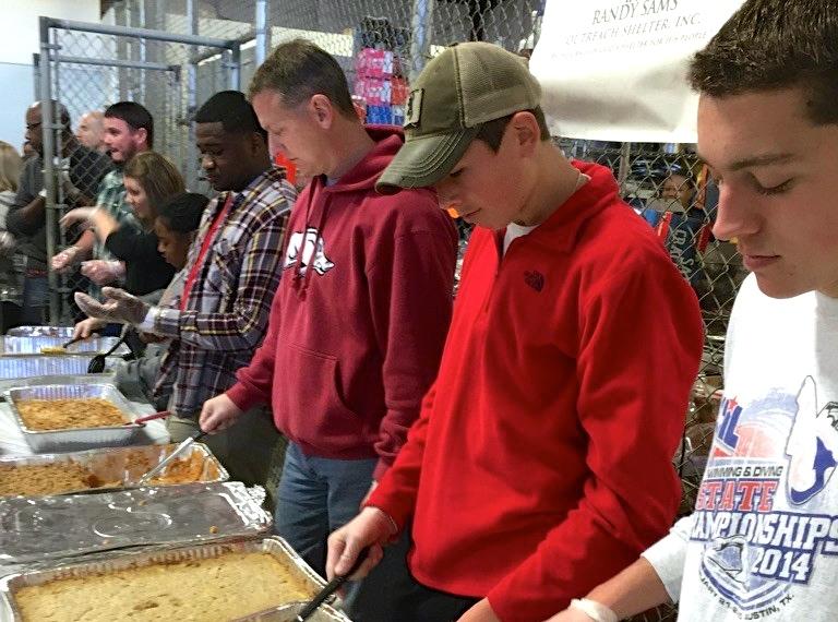 Snell serves food at the local Salvation Army for those in need over the holidays