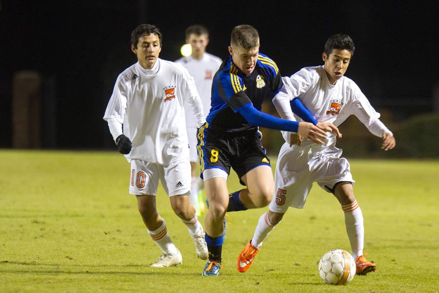 Axel Contreras fights for the ball during the varsity boys soccer game against North Lamar. 