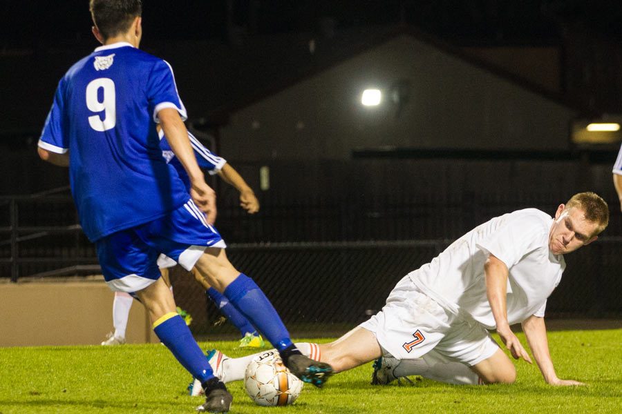 Senior Mantas Urniezius slides to steal from Sulpher Springs.