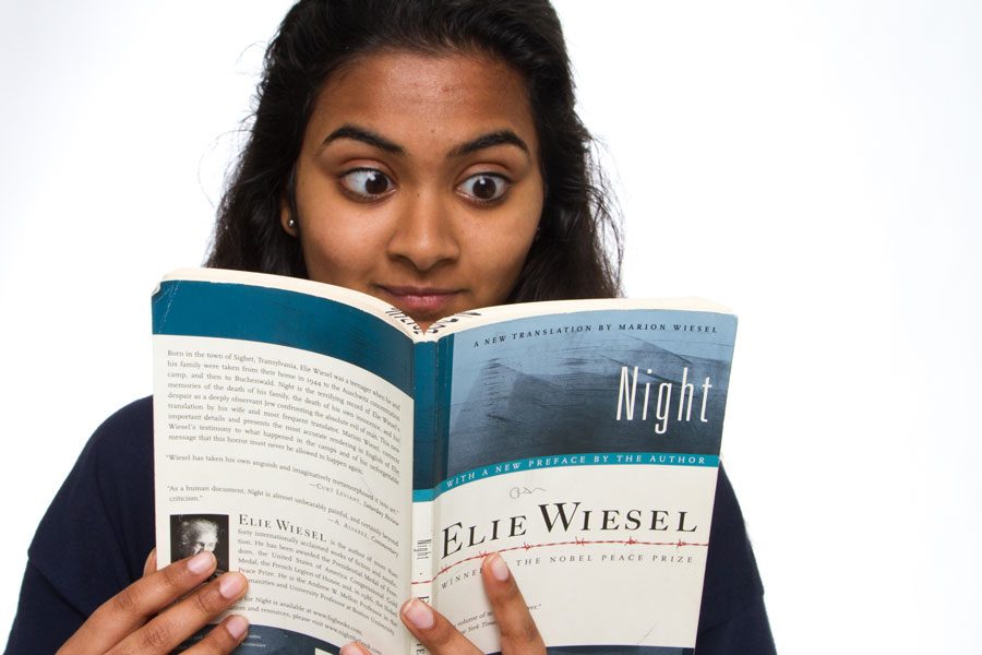 Sophomore+Raga+Justin+pictured+reading+book+Night+by+Elie+Wiesel.