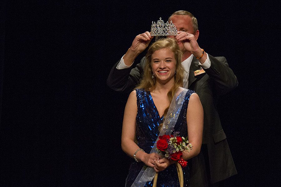 Senior Katherine Doan receiving her crown from Principal Brad Bailey.