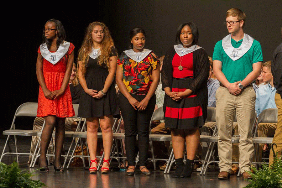 Seniors Marteyjah Beard Handy, Oralia Basurto-Ruiz, Wanita Bailey, Kierra Bagsby and Jordan Addison receiving their National Honor Society collars. 