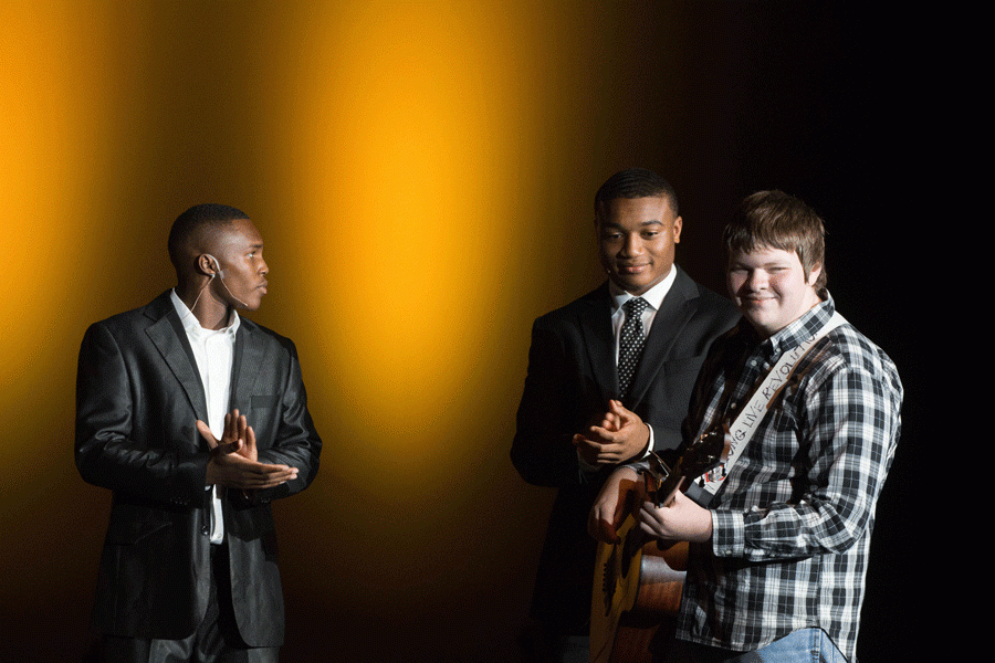 Junior Chaz Davis and senior KJ Reid host freshman Colin Runnels at Tigers Got Talent. 