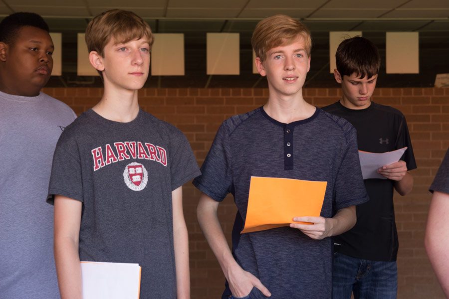 Freshmen examine their new schedules at Texas Highs annual Tiger Camp. The camp was held on Aug. 15 and allows freshmen to adjust to Texas High before the first day of school.