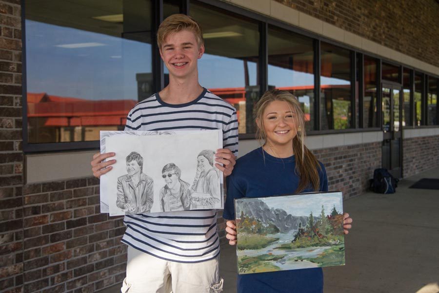 Colton Johnston and Jera Davis display their artwork that will be featured in Texas Congressman John Ratcliffe’s office.