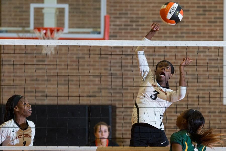 Freshman Unique McBride spikes against the Lobos in the variety match Sept. 22, 2015. 