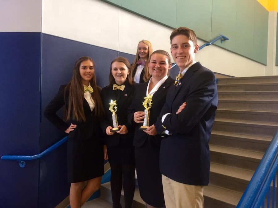 The debate team displays their awards after their competition on Sept. 19.