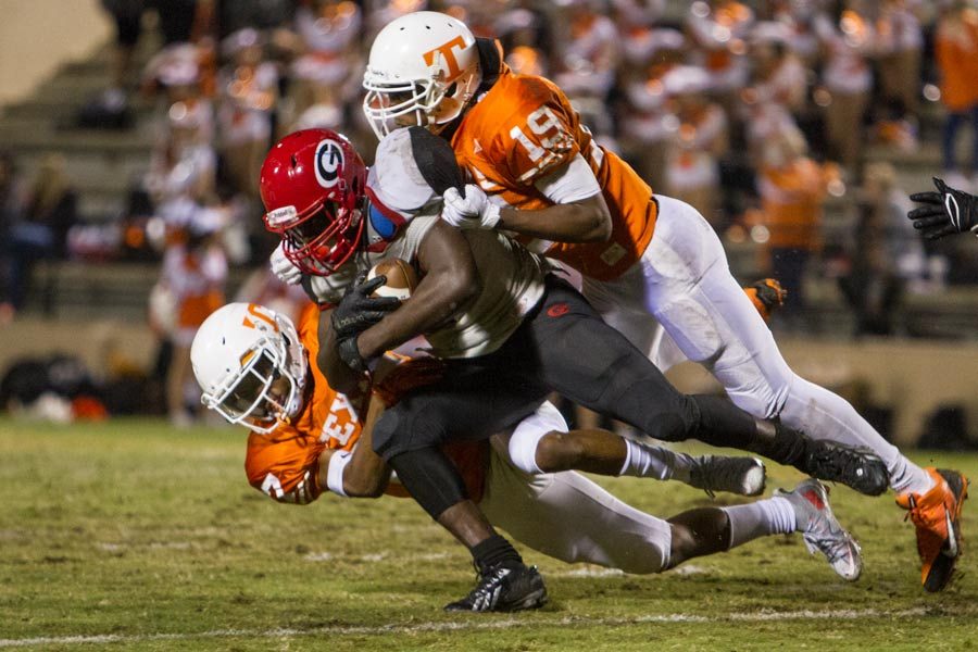 Texas+Highs+Eric+Sutton+and+Jacobi+Brewer+tackle+Greenvilles+running+back+Friday+night+at+Grimm+Stadium.+The+Tiger+defense+accounted+for+14+points+in+the+game.