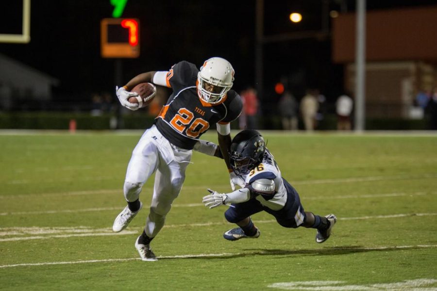 Texas Highs Markese Martin eludes a Pine Tree defender Oct. 10, 2015. The Tigers won their homecoming game 38 - 16.