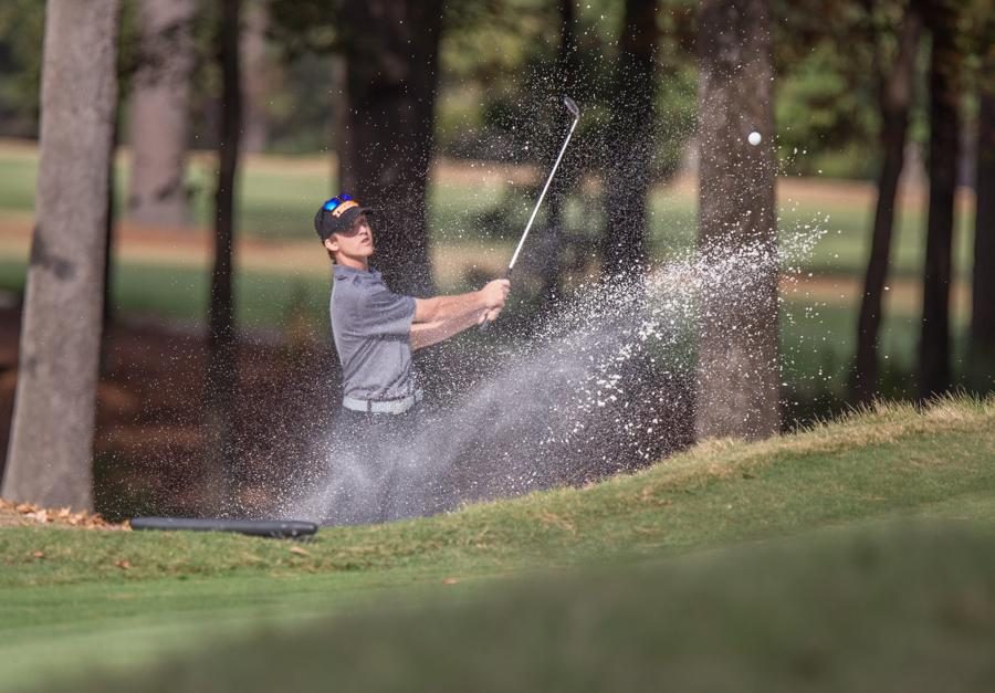 Sophomore Matt Prieskorn hitting a bunker shot at the Tiger Classic. 