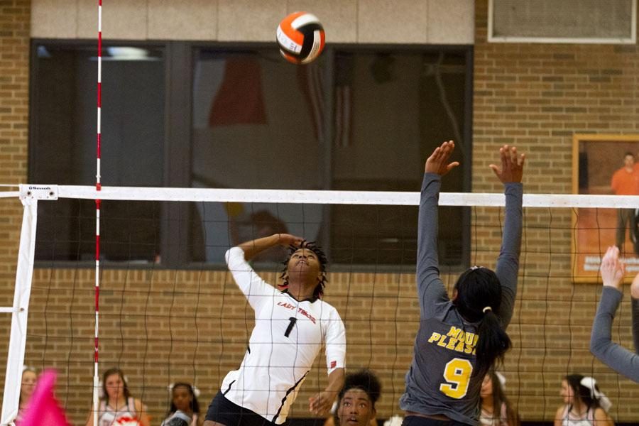 Junior Takeba Dowden returns the ball durning the volleyball game against Mt. Pleasant. The Lady Tigers won, 3-0.