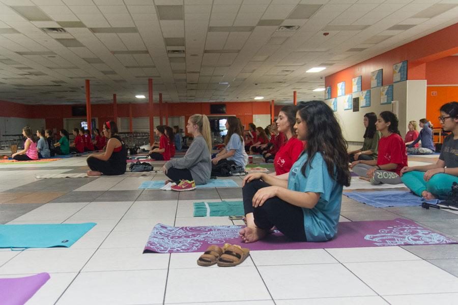 Members of Rosebuds Junior Garden Club meditate during their yoga class.