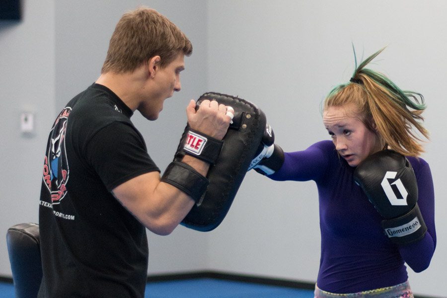 Sophomore Michayla Hellums practices jiu jitsu with coach Craig Campbell