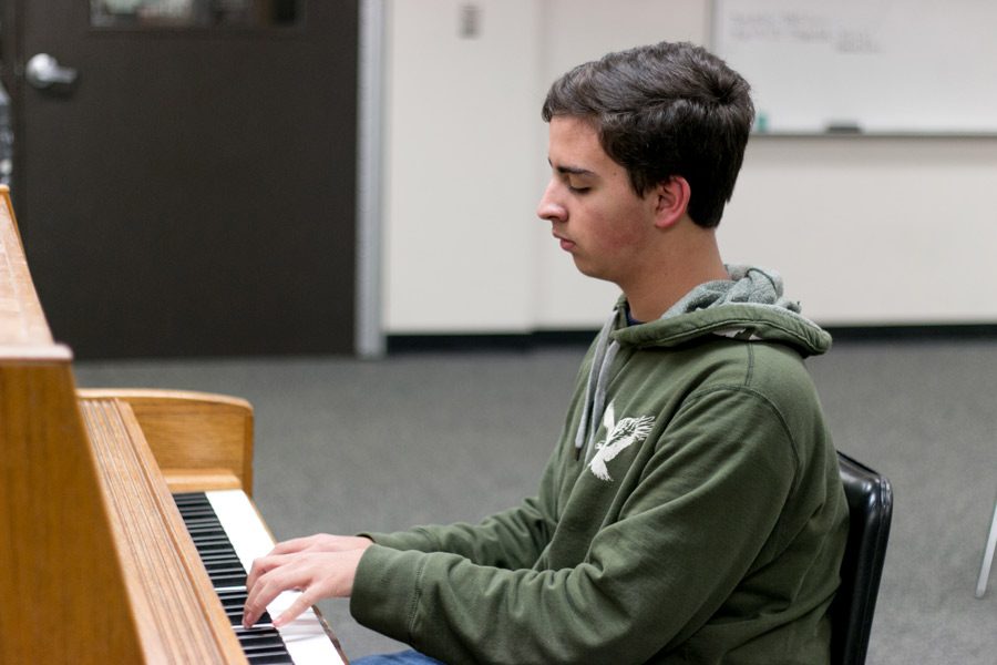 Freshman+Craig+Crawford+plays+the+piano.+Crawford+has+been+practicing+music+since+he+was+7+years+old.