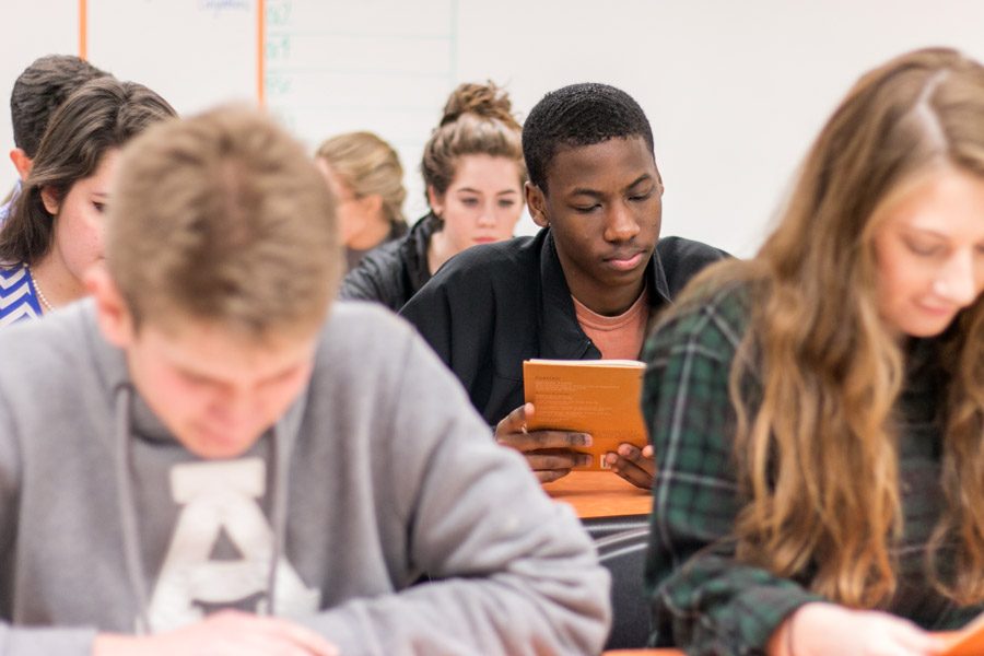 Junior Ricky reads in his AP English class.