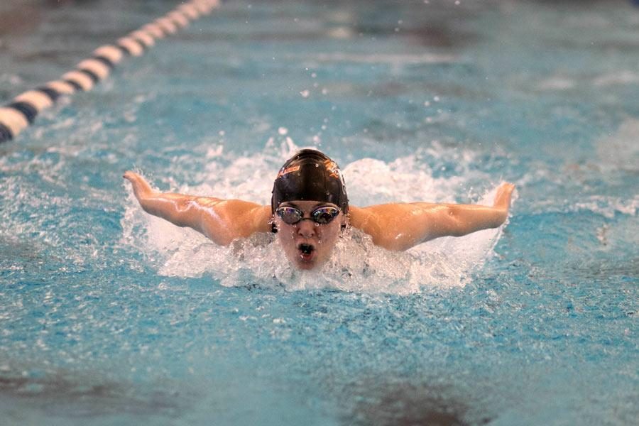 Junior Cathryn Payne swims butterfly in the 200 individual medley.