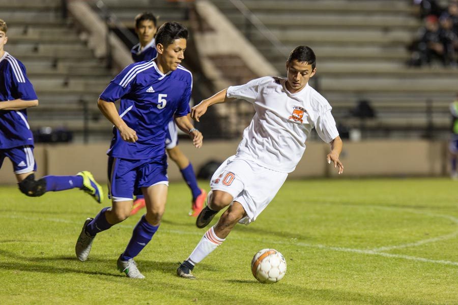 Senior+Roger+Moreno+steals+the+ball+from+a+Hallsville+player.+The+Texas+High+boys+varsity+soccer+team+was+defeated+by+Hallsville+Bobcats.