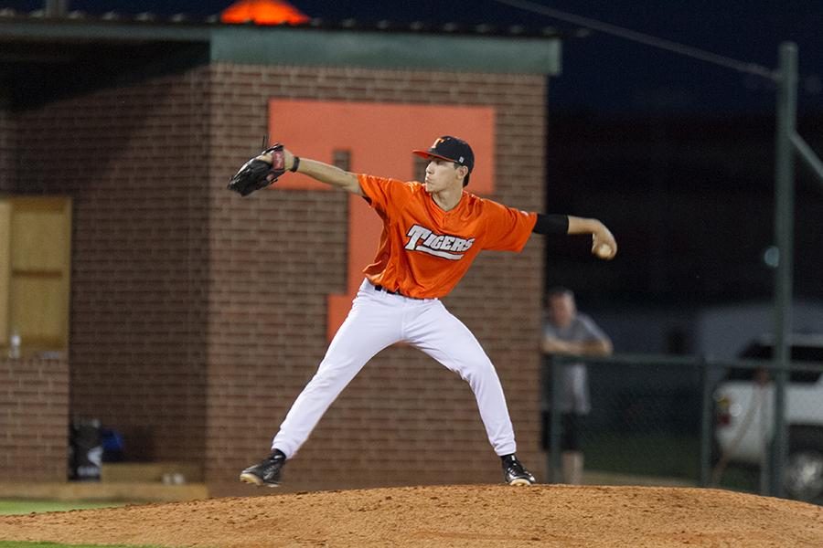 Senior Zack Philips pitches the ball during the first home game against Sulphur Springs.