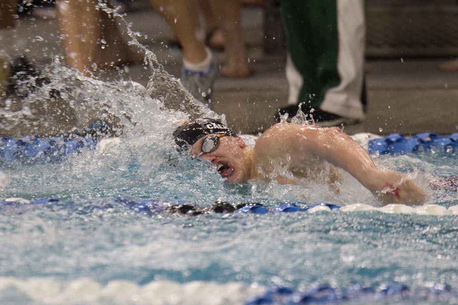 Senior Luke Calhoon swims freestyle in the 200 individual medley. Calhoon placed 16th at State.