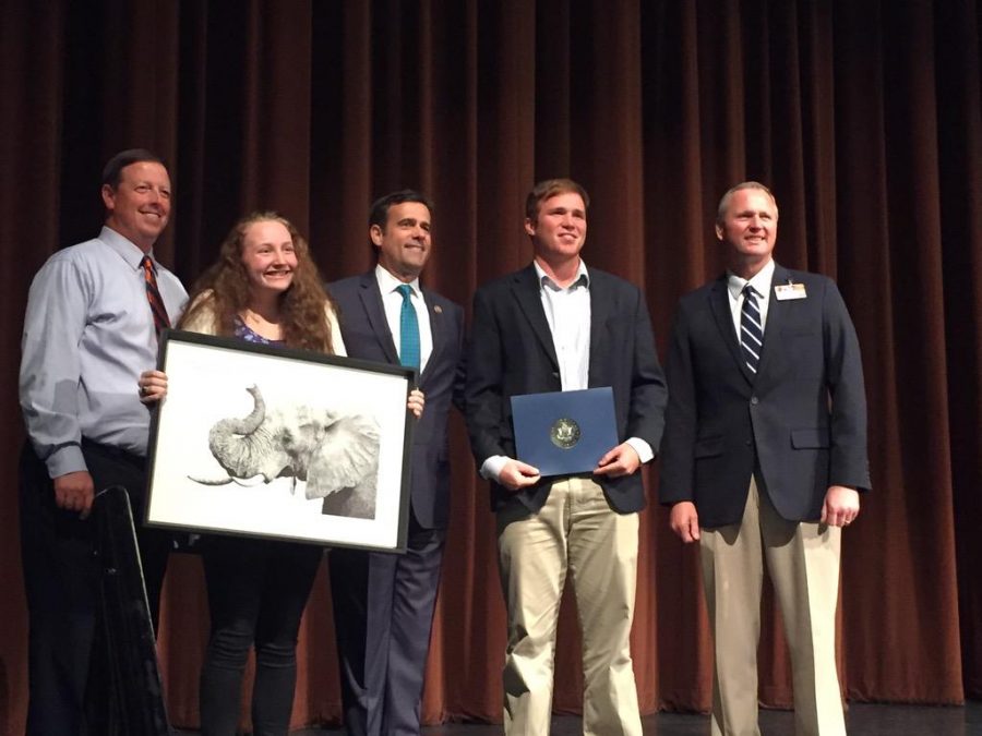 Superintendent Paul Norton, junior Rylie Power, senior Kip Williams, stand with U.S. Congressman John Ratcliffe, accepting Congressional awards. 