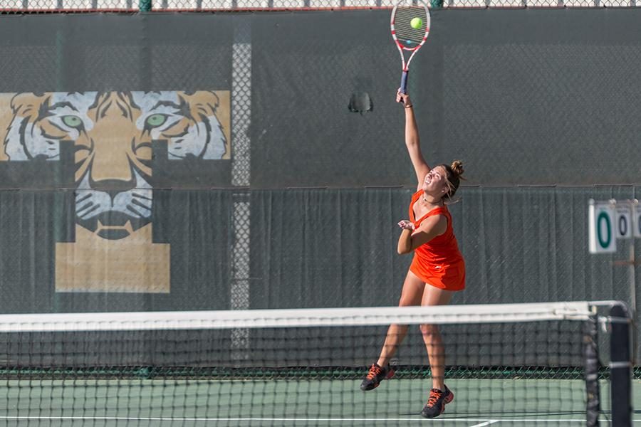 Senior Aubrey Cramer serves the ball.