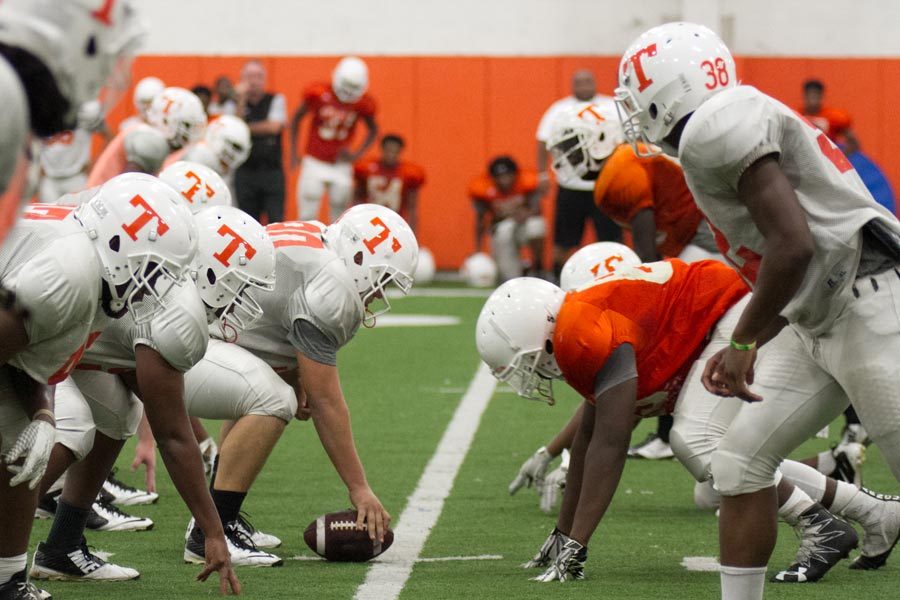 Varsity offense and defense square off at a football practice in the multipurpose facility. The Tigers have been  working for several weeks indoors because of recent bad weather. 