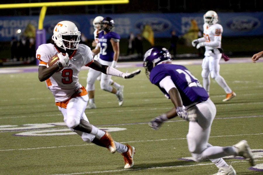 Texas Highs Tevailance Hunt avoids a Hallsville defender Oct. 28, 2016. The Tigers extended their winning streak to 9 and remain undefeated in the 2016 season.