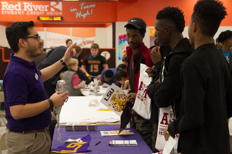 Students visit with an LSU recruiter.