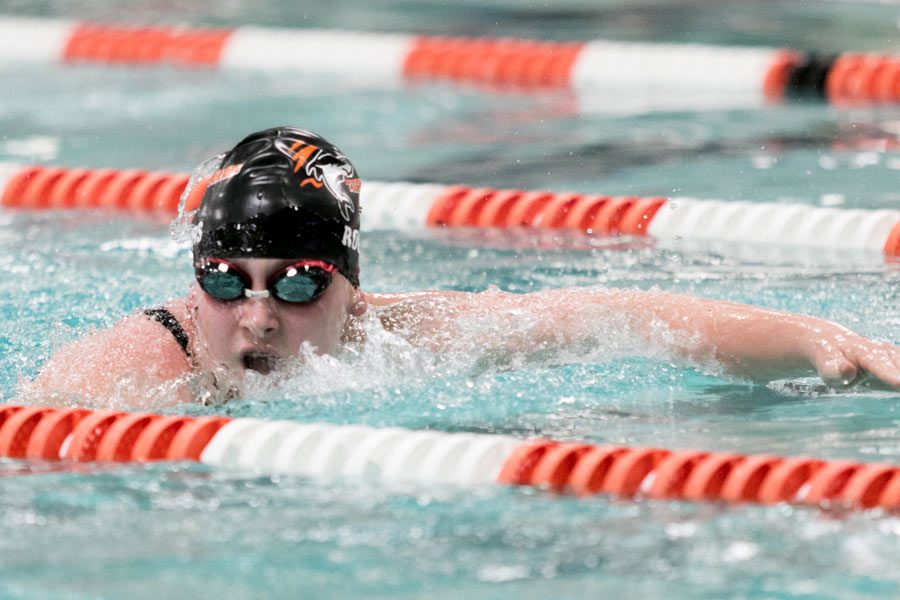 Freshman Kaitlyn Rogers swims at the home meet.